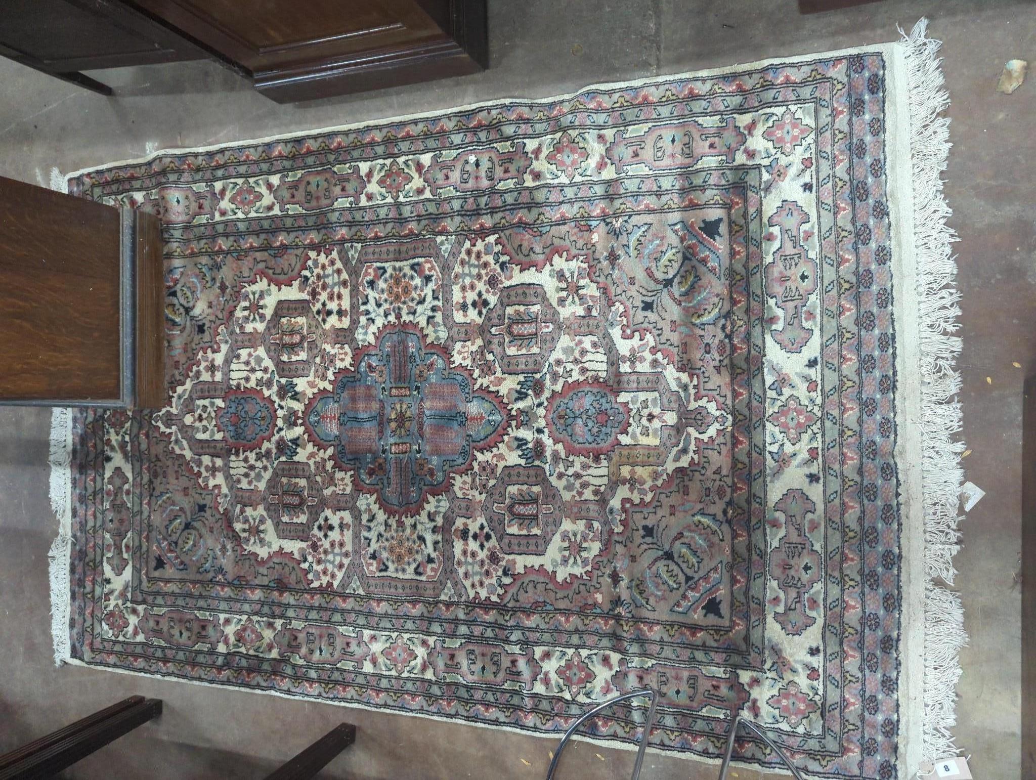 A North West Persian style ivory ground rug, 190 x 122cm